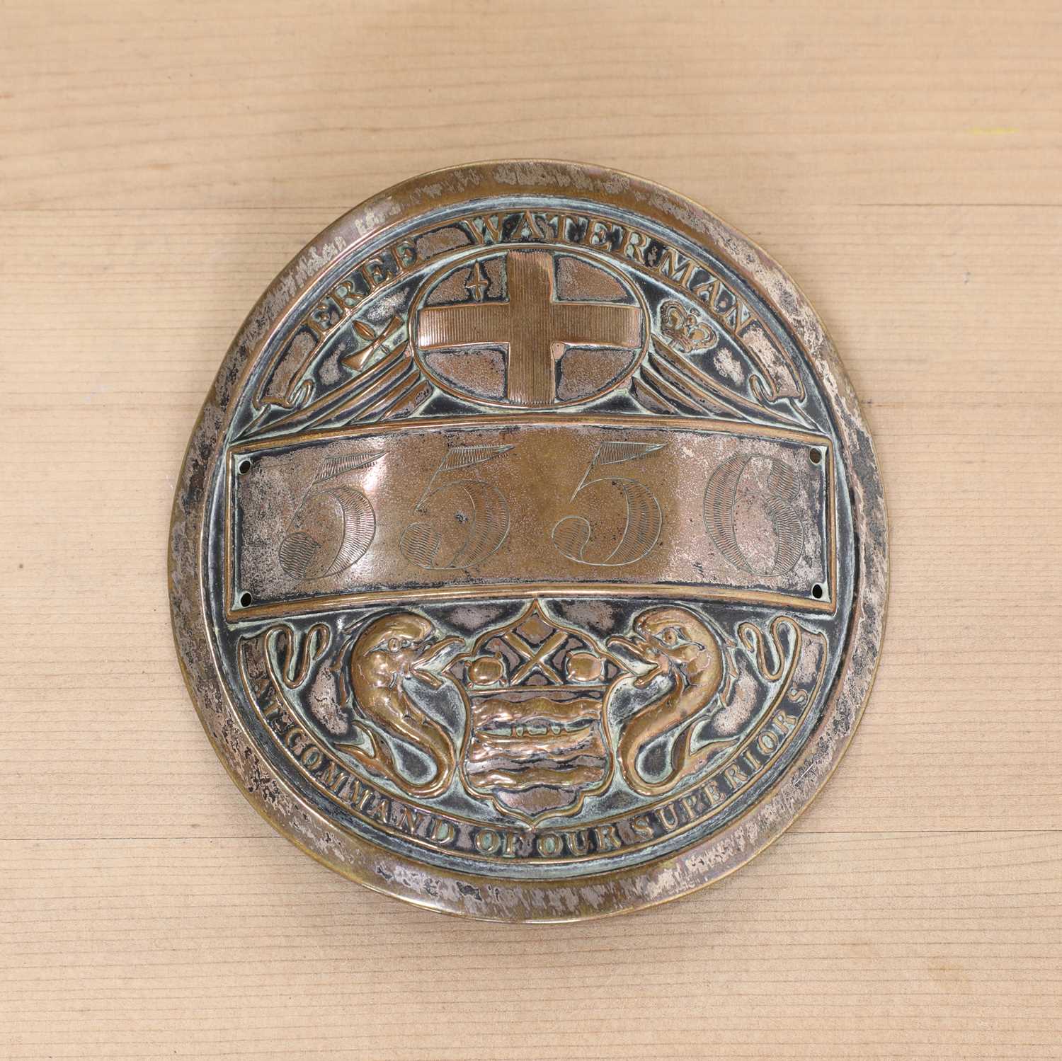 Lot 363 - A silver-plated copper Free Waterman badge