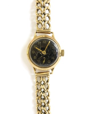 Lot 226 - A ladies' 9ct gold Tissot mechanical bracelet watch