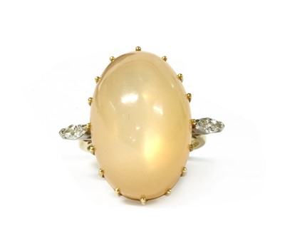 Lot 144 - An 18ct gold moonstone and diamond ring