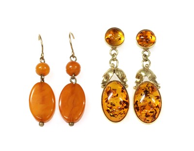 Lot 145 - A pair of butterscotch amber drop earrings