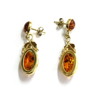 Lot 145 - A pair of butterscotch amber drop earrings
