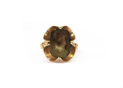 Lot 141 - A gold single stone smoky quartz ring
