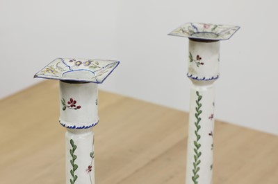 Lot 432 - A pair of enamel candlesticks