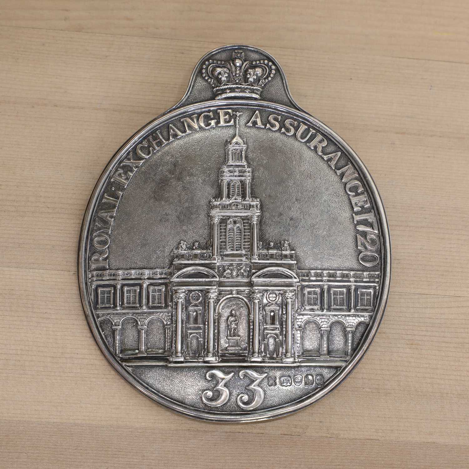 Lot 367 - A George IV silver Royal Exchange Assurance fireman's arm badge