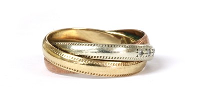 Lot 33 - A 9ct three colour gold diamond set three band ring