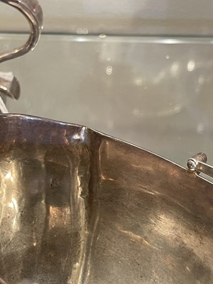 Lot 6 - A George III silver swing-handled sugar basket