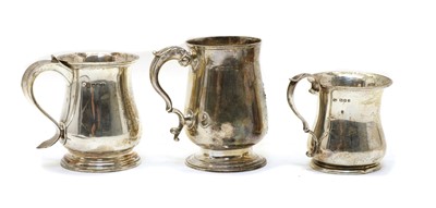 Lot 5 - Three silver baluster mugs