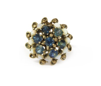 Lot 181 - A Thai gold sapphire and opal ring