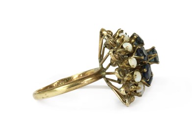Lot 181 - A Thai gold sapphire and opal ring