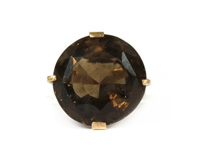 Lot 202 - A gold single stone smoky quartz ring