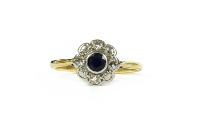 Lot 166 - A gold sapphire and diamond cluster ring