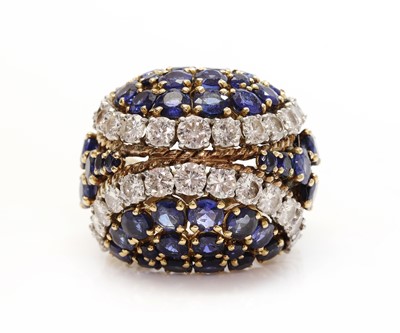 Lot 271 - An 18ct gold and platinum, diamond and sapphire bombé ring, c.1950