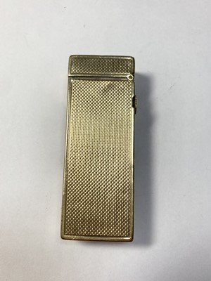 Lot 283 - A 9ct gold gas lighter