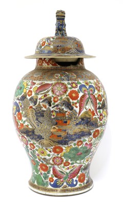Lot 299 - A Chinese export clobbered blue and white jar and cover