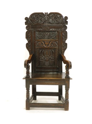 Lot 558 - An oak wainscot chair