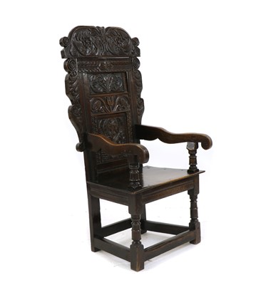 Lot 558 - An oak wainscot chair