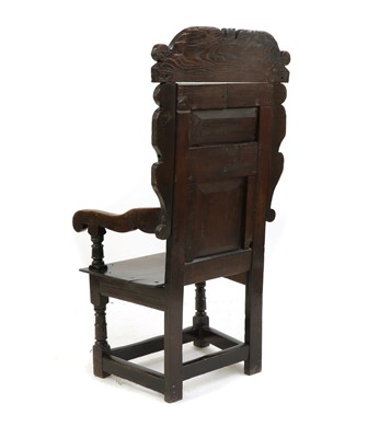 Lot 558 - An oak wainscot chair