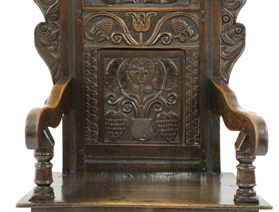 Lot 558 - An oak wainscot chair