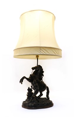 Lot 191A - After Guillaume Cousteau, a spelter Marly horse figural lamp