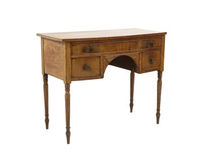 Lot 580 - A Regency mahogany bow front dressing table