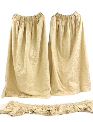 Lot 524 - A pair of cream damask silk curtains