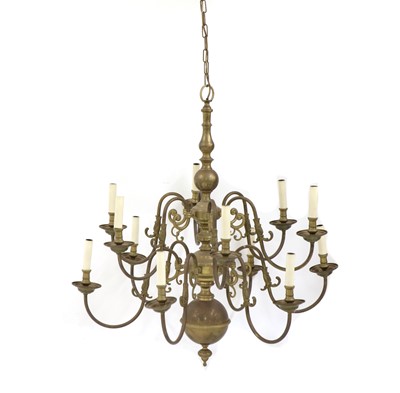 Lot 541 - A Dutch style brass twelve-light chandelier