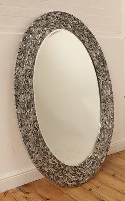 Lot 766 - A contemporary oval aluminium mirror
