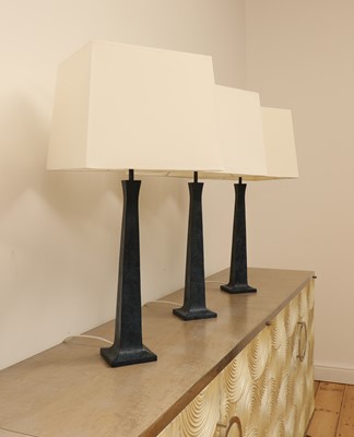 Lot 651 - A set of three Maison Charles 'Pyramide' patinated bronze table lamps