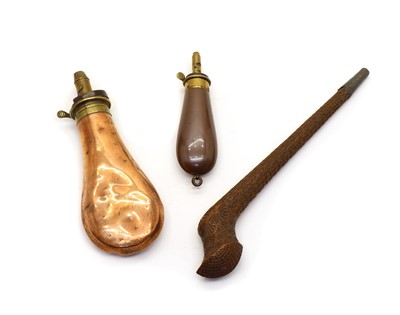 Lot 200 - Two copper and brass powder flasks and a wooden pipe case