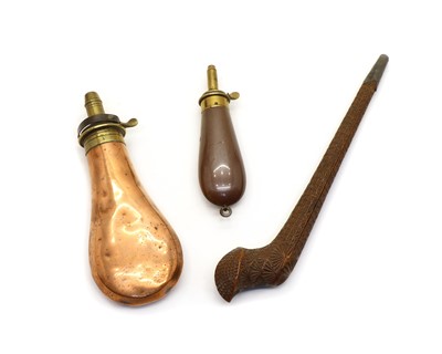 Lot 200 - Two copper and brass powder flasks and a wooden pipe case