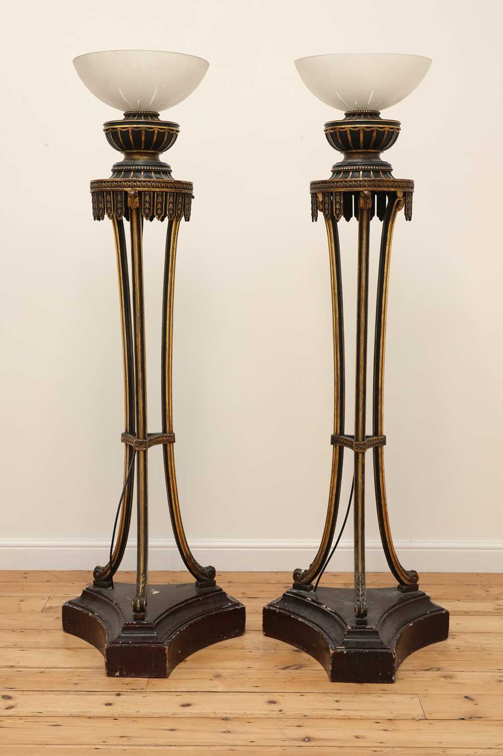 Lot 45 - A pair of carved and painted torchères
