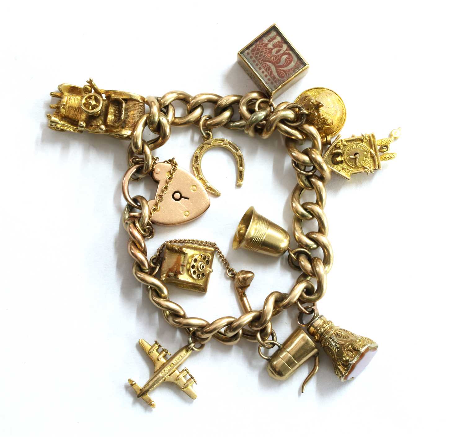 Lot 59 - A gold charm bracelet