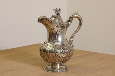 Lot 349 - A Victorian silver hot water jug with ivory insulators