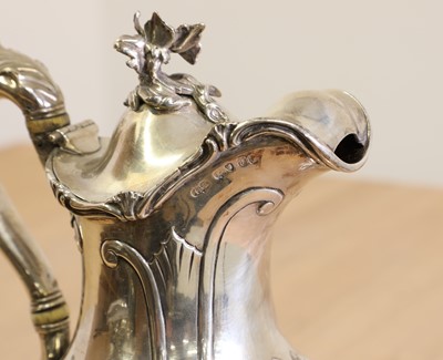 Lot 349 - A Victorian silver hot water jug with ivory insulators