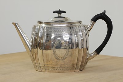 Lot 332 - A Victorian silver teapot in the George III style