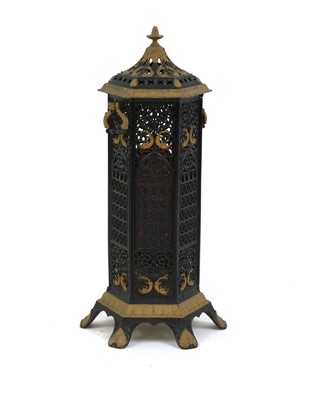 Lot 610 - A Gothic Revival wrought iron and gilt veritas stove