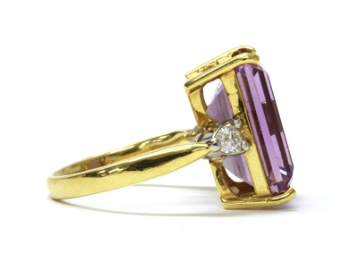 Lot 193 - An 18ct gold amethyst and diamond three stone ring