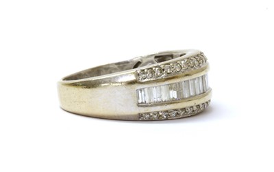 Lot 78 - An 18ct white gold three row diamond set half hoop ring