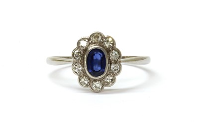 Lot 165 - A white gold sapphire and diamond cluster ring