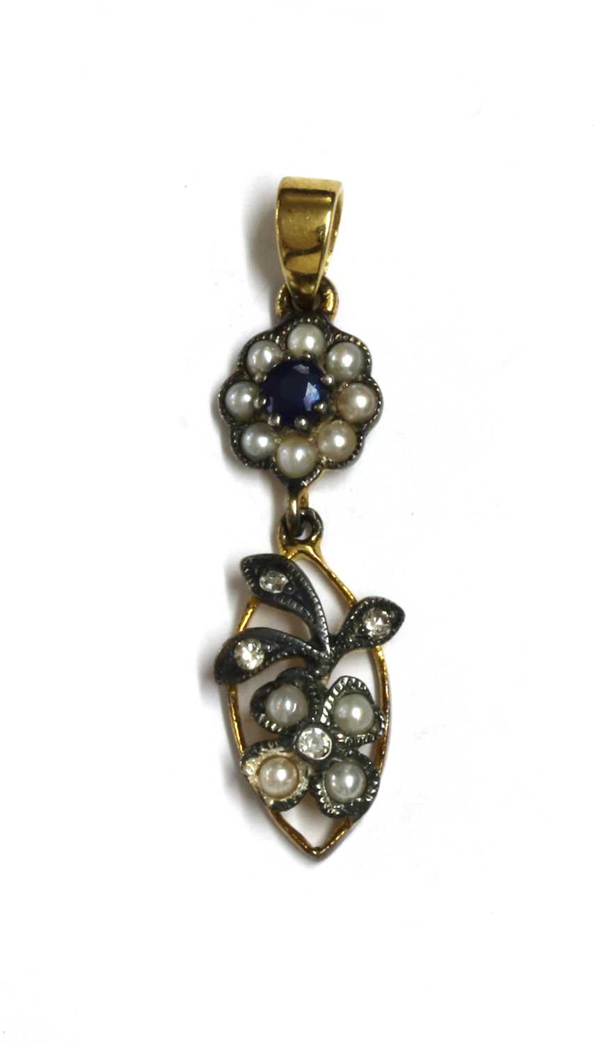 Lot 173 - A silver and gold, sapphire, split pearl and diamond pendant