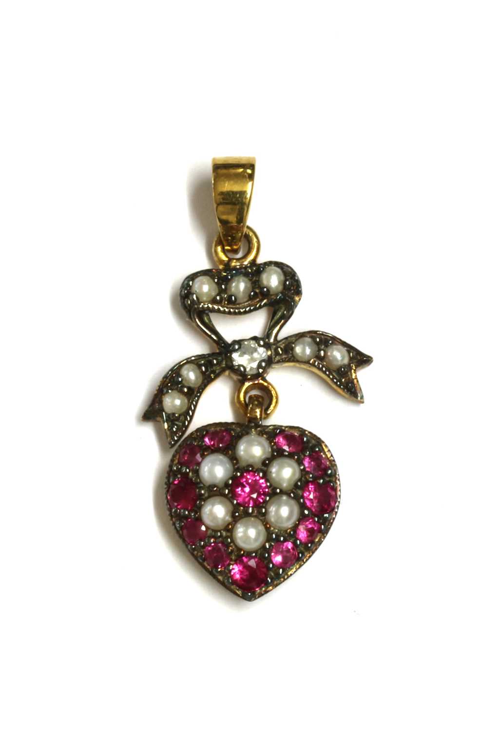 Lot 132 - A silver and gold, ruby, diamond and split pearl drop pendant