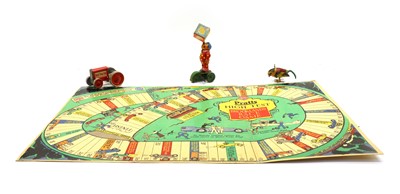 Lot 182 - Three tin plate toys and a folding race game board