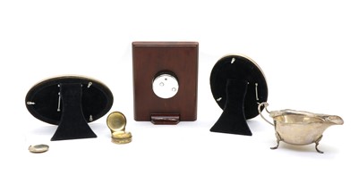 Lot 24 - A silver cased Harrods boudoir clock