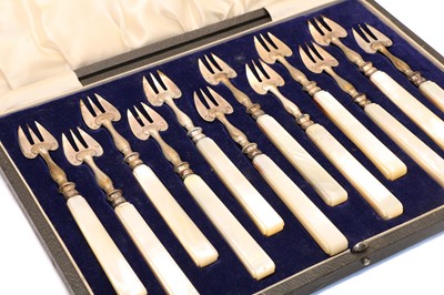 Lot 23 - A cased set of twelve Continental silver hors d'ourves forks