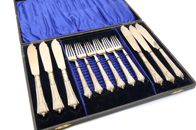 Lot 23 - A cased set of twelve Continental silver hors d'ourves forks