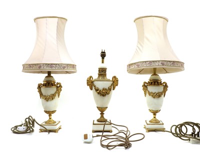 Lot 200 - A pair of Classical style white marble and gilt metal urn form table lamps