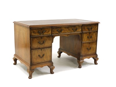 Lot 298 - A George III style walnut pedestal desk