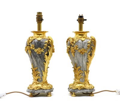 Lot 96 - A pair of grey marble and ormolu table lamps of vase form