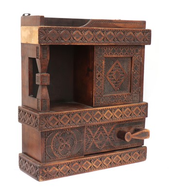 Lot 34 - A chip-carved wooden wall-hanging cabinet