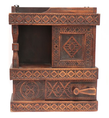 Lot 34 - A chip-carved wooden wall-hanging cabinet